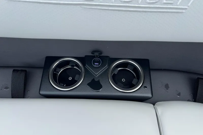 Slide: The Image of Cup holders and USB port on 2025 Harris Cruiser 230 boat interior. - 14