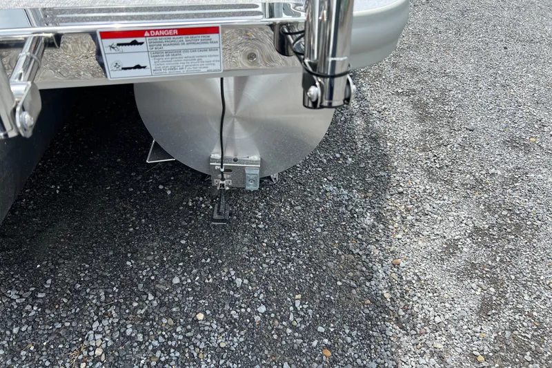 Slide: The Image of Rear view of 2025 Harris Cruiser 230 pontoon boat on gravel surface. - 15