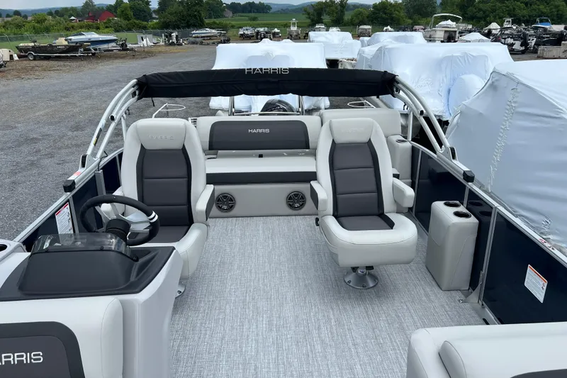 Slide: The Image of 2025 Harris Cruiser 230 pontoon boat interior with plush seating and modern design. - 3