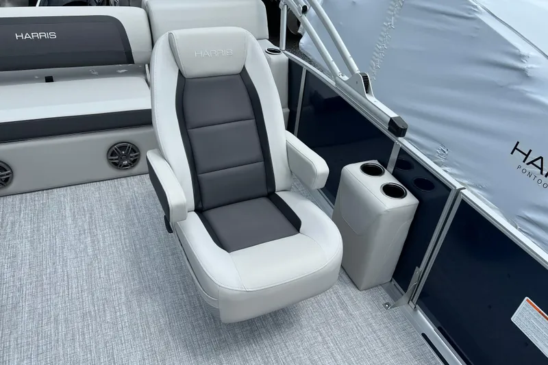 Slide: The Image of 2025 Harris Cruiser 230 boat interior with plush seating and cup holders. - 4