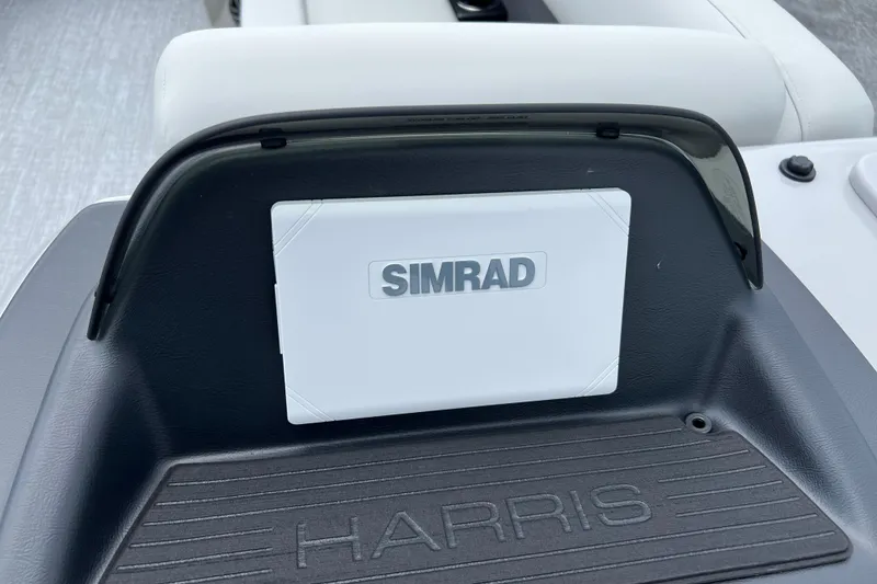 Slide: The Image of 2025 Harris Cruiser 230 dashboard featuring Simrad navigation system. - 9