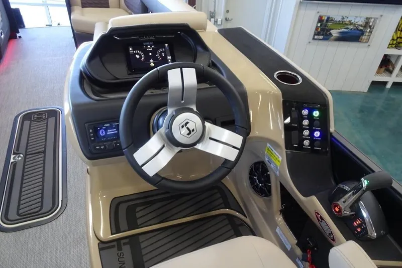 Slide: The Image of 2026 Harris Sunliner 250 Sport boat dashboard with steering wheel and control panel. - 18