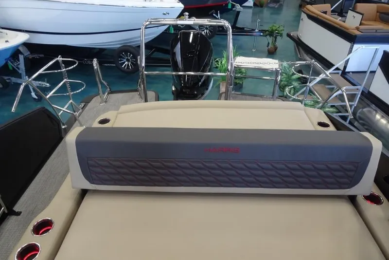 Slide: The Image of 2026 Harris Sunliner 250 Sport boat interior with plush seating and modern design. - 24