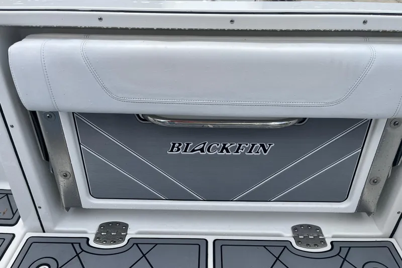 Slide: The Image of 2021 Blackfin 252 CC boat seat with logo and sleek design. - 10