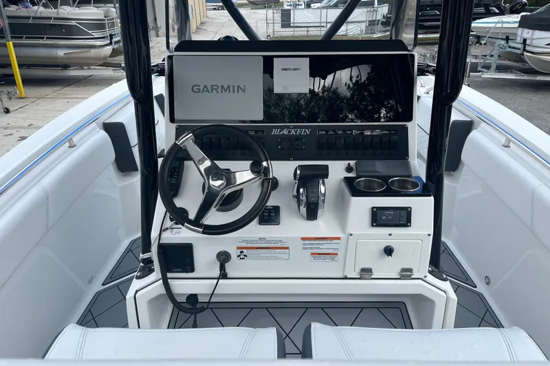 Slide: The Image of 2021 Blackfin 252 CC boat console with Garmin navigation system and modern controls. - 16