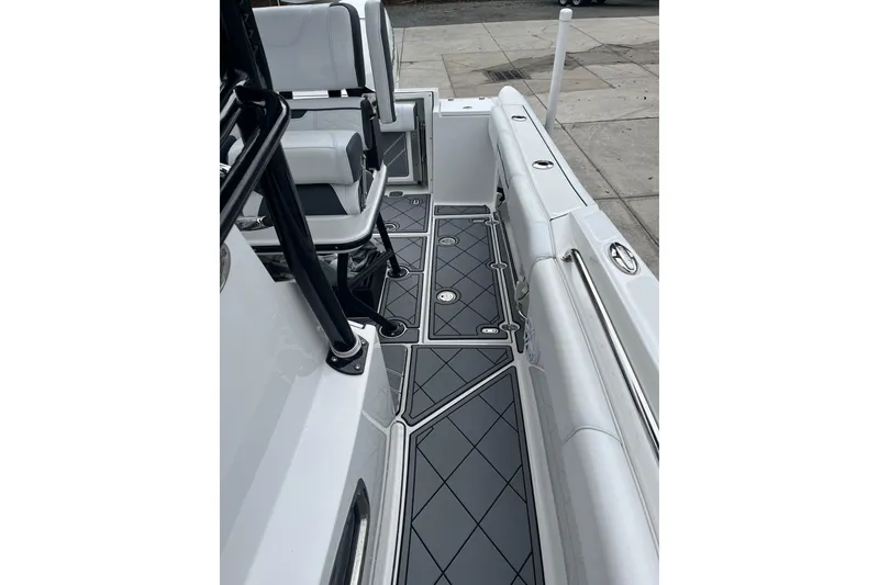 Slide: The Image of 2021 Blackfin 252 CC boat interior with sleek seating and modern flooring design. - 23