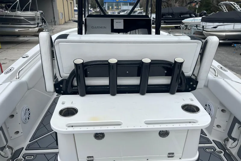 Slide: The Image of 2021 Blackfin 252 CC boat interior with rod holders and Garmin equipment. - 24