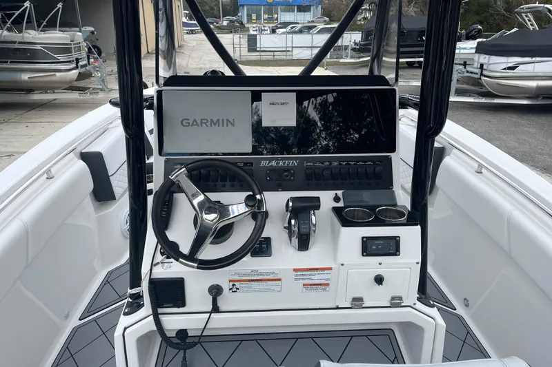 Slide: The Image of 2021 Blackfin 252 CC boat console with Garmin navigation system and steering wheel. - 26