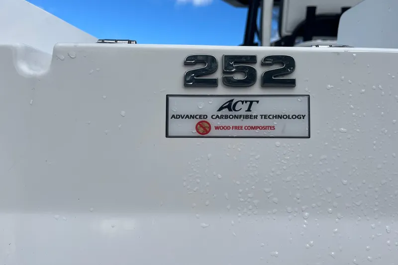 Slide: The Image of 2021 Blackfin 252 CC boat with Advanced Carbonfiber Technology, featuring wood-free composites. - 8