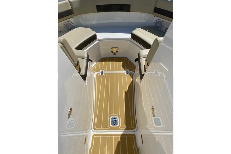 Slide: The Image of 2020 Pursit DC 325 boat interior with tan seating and teak-style flooring. - 13