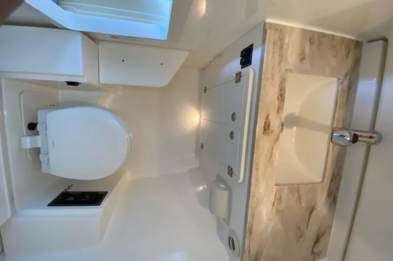 Slide: The Image of Compact bathroom in 2020 Pursit DC 325 boat with toilet and sink. - 17