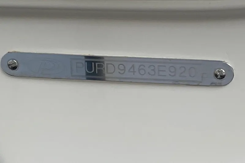 Slide: The Image of Metallic identification plate on a 2020 Pursit DC 325 boat. - 22