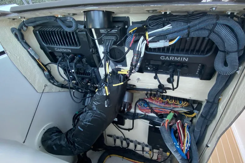 Slide: The Image of Wiring and Garmin electronics inside a 2020 Pursit DC 325 boat. - 23