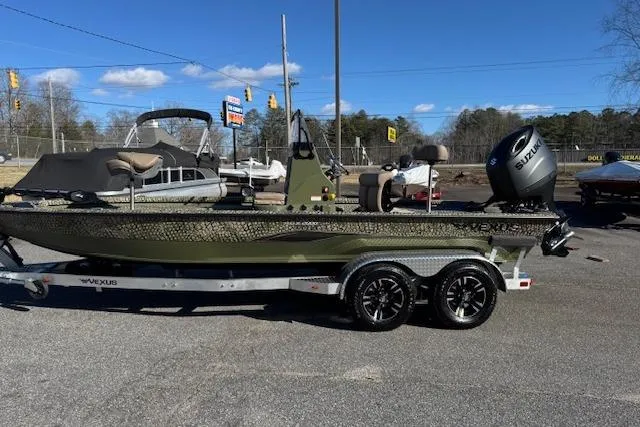 The Image of 2026 Vexus ACX 2000 boat on trailer, parked outdoors under clear blue sky. - 0
