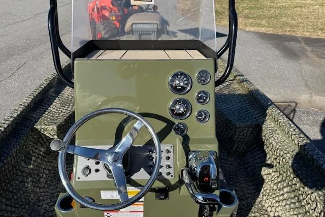 Slide: The Image of 2026 Vexus ACX 2000 boat dashboard with steering wheel and control panel. - 12