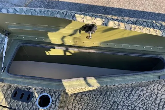 Slide: The Image of 2026 Vexus ACX 2000 boat storage compartment with textured surface and secure latch. - 15