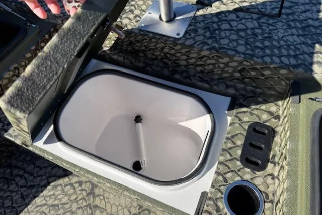 Slide: The Image of 2026 Vexus ACX 2000 boat interior with open storage compartment and textured flooring. - 17