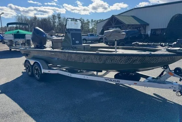 Slide: The Image of 2026 Vexus ACX 2000 boat on trailer, parked outdoors under a clear sky. - 3