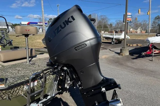 Slide: The Image of 2026 Vexus ACX 2000 boat with Suzuki outboard motor in outdoor setting. - 5