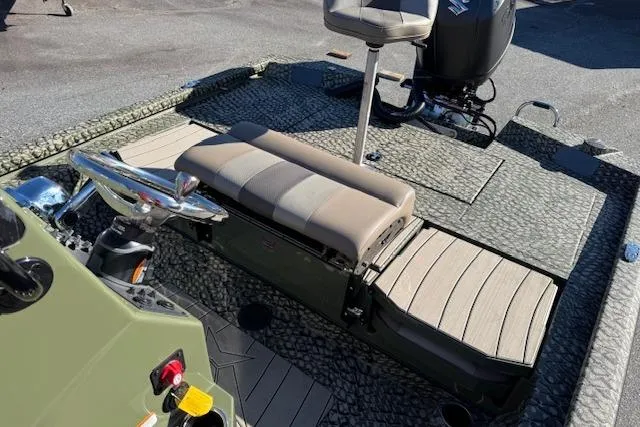 Slide: The Image of 2026 Vexus ACX 2000 boat interior with seating and motor, featuring textured flooring. - 9