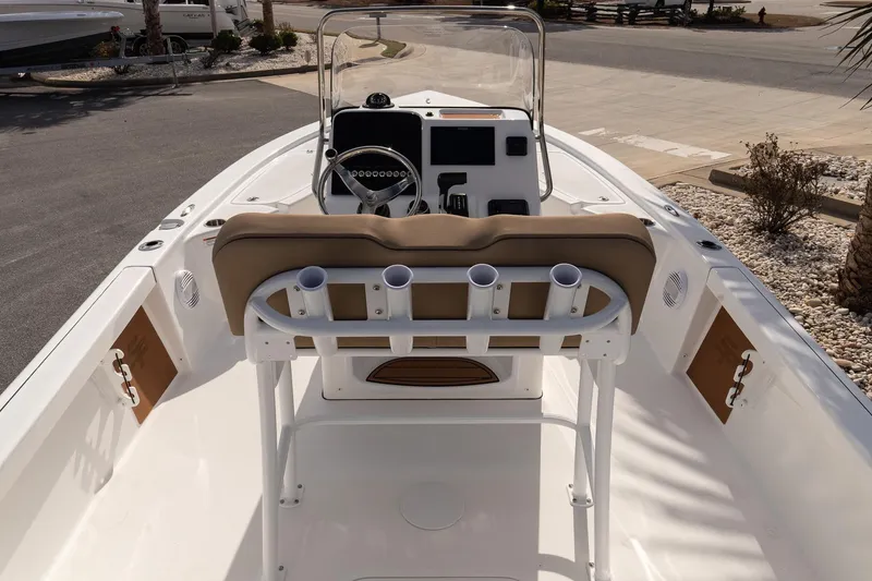 Slide: The Image of 2026 Sea Pro 210 Bay boat interior with steering console and seating. - 10