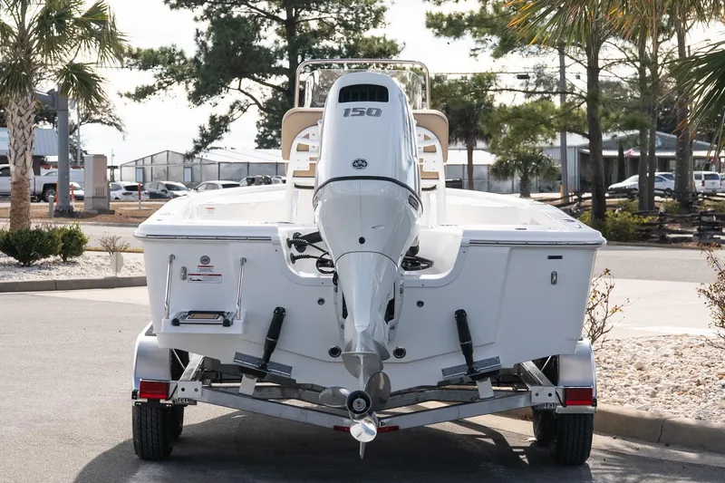 Slide: The Image of 2026 Sea Pro 210 Bay boat on trailer, rear view with outboard motor. - 5