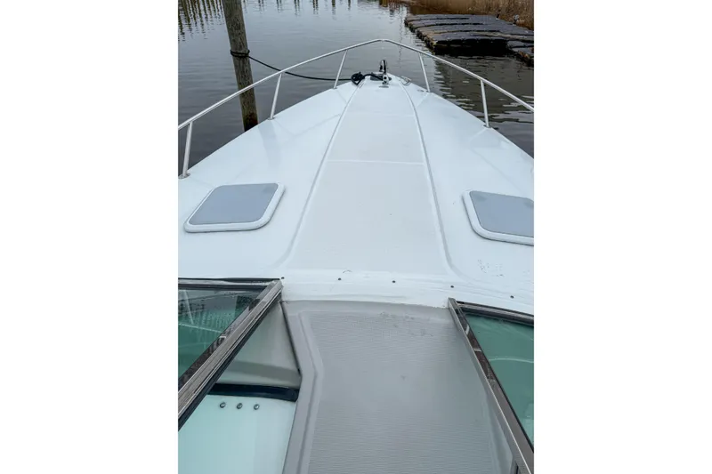 Slide: The Image of 2004 Formula 330 Sun Sport boat deck view at dockside. - 11