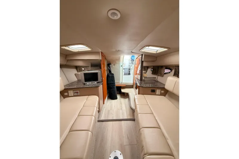 Slide: The Image of Interior of 2004 Formula 330 Sun Sport boat with beige seating. - 14