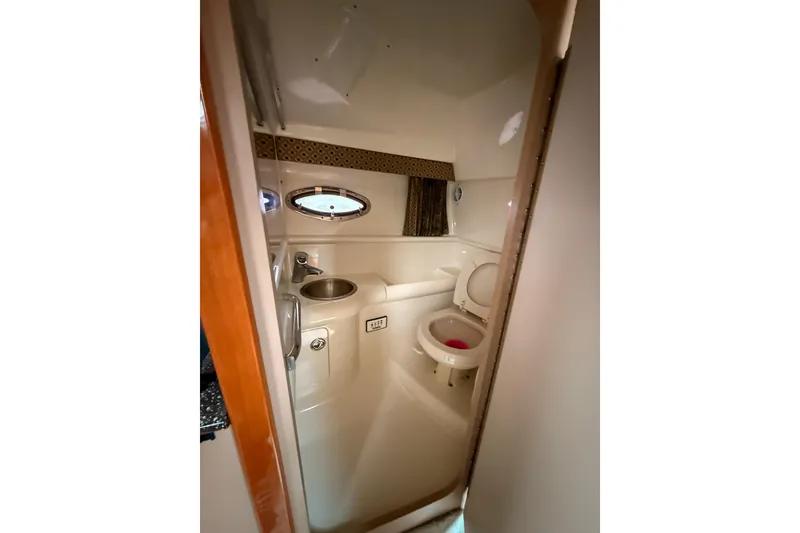 Slide: The Image of 2004 Formula 330 Sun Sport boat bathroom with sink and toilet. - 16