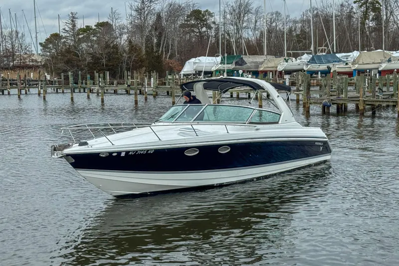 Slide: The Image of 2004 Formula 330 Sun Sport boat in harbor. - 2