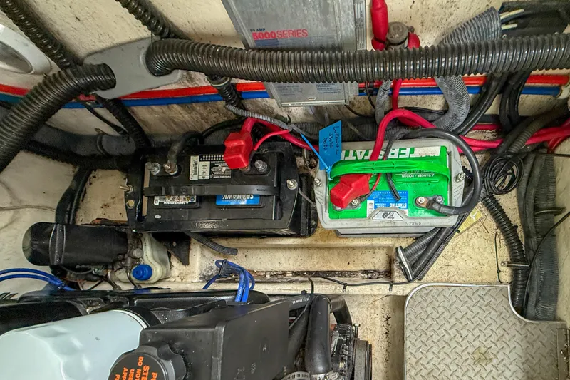 Slide: The Image of Engine compartment of a 2004 Formula 330 Sun Sport with batteries and wiring. - 22