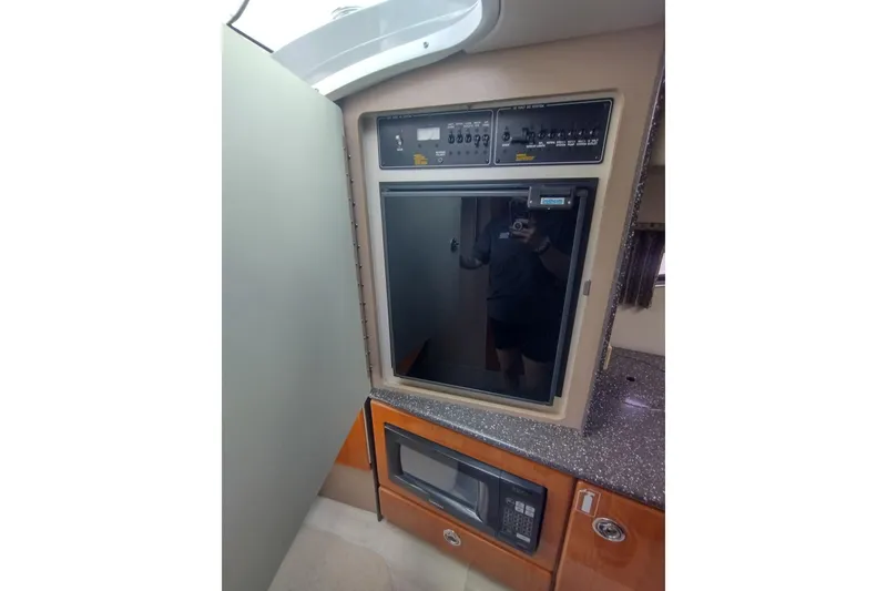 Slide: The Image of 2004 Formula 330 Sun Sport interior with fridge and microwave. - 24