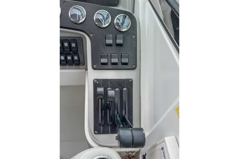 Slide: The Image of Control panel of a 2004 Formula 330 Sun Sport boat with gauges and switches. - 8
