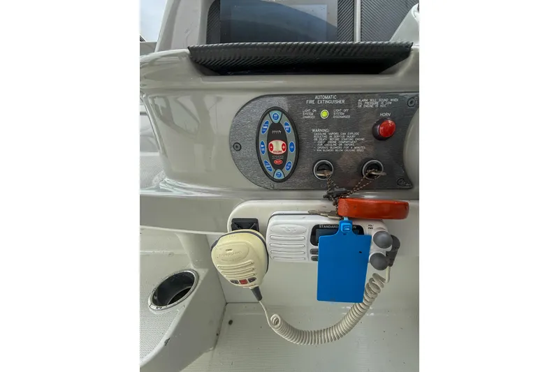 Slide: The Image of Control panel of a 2004 Formula 330 Sun Sport boat with communication equipment. - 9