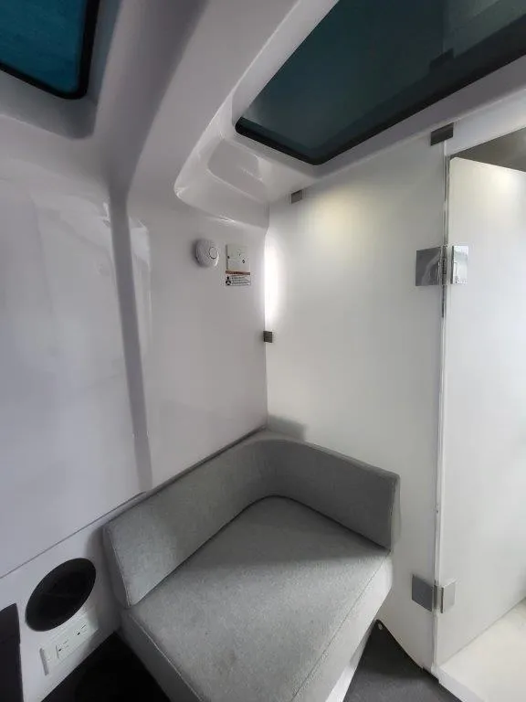 Slide: The Image of 2024 Axopar 37 XC CROSS CABIN interior with modern seating and sleek design. - 27