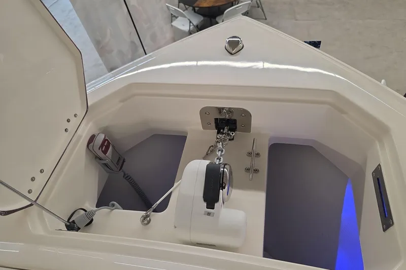 Slide: The Image of 2026 Sailfish 272 CC boat anchor compartment with chain and winch system. - 13