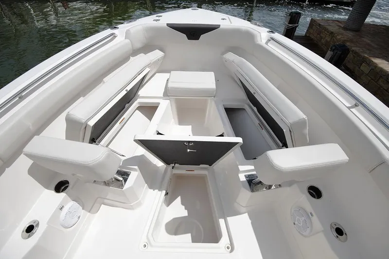 Slide: The Image of Manufacturer Provided Image: 2026 Sailfish 272 CC boat interior with white seating and storage compartments. - 3