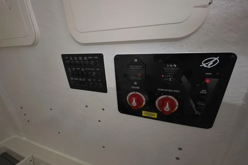 Slide: The Image of Electrical panel of 2026 Sailfish 272 CC boat, featuring switches and controls. - 30