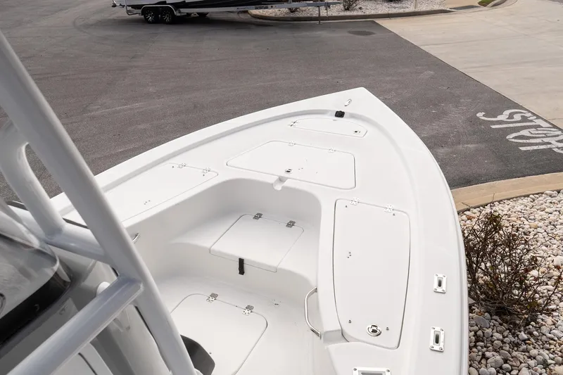 Slide: The Image of 2025 Sea Pro 230 Bay boat deck with storage compartments. - 14