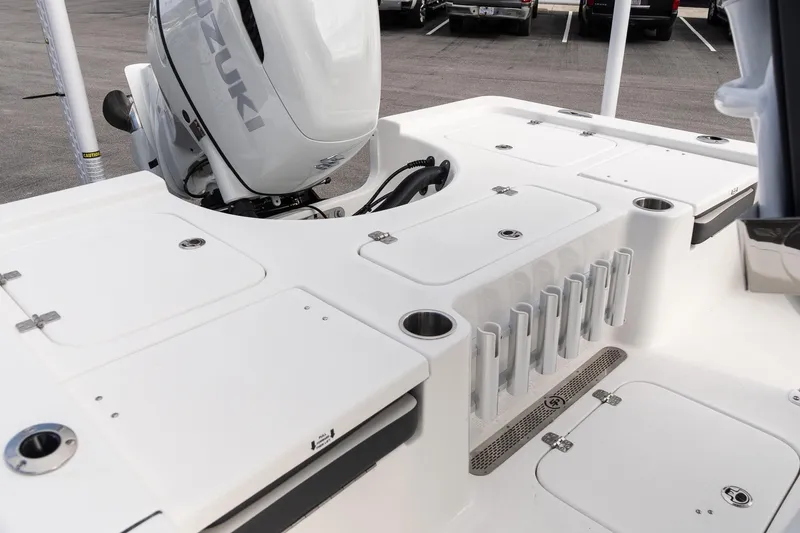 Slide: The Image of 2025 Sea Pro 230 Bay boat deck with Suzuki engine and storage compartments. - 7