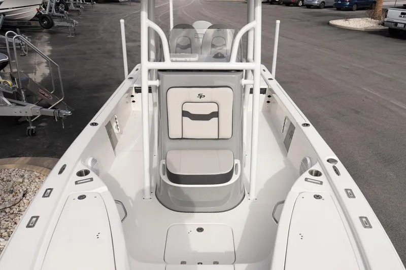 Slide: The Image of 2025 Sea Pro 230 Bay boat interior, featuring seating and storage compartments. - 16