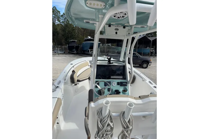 Slide: The Image of 2021 Tidewater 232 CC Adventure boat interior with modern console and seating. - 5