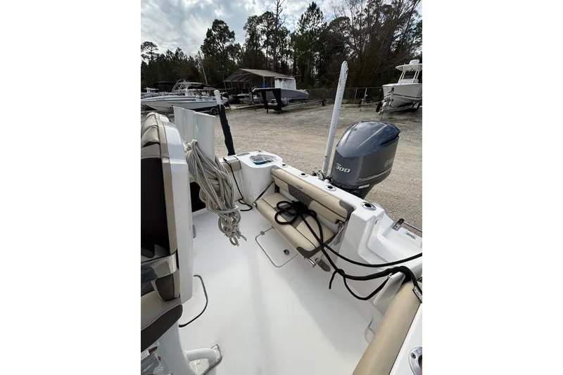 Slide: The Image of 2021 Tidewater 232 CC Adventure boat with Yamaha 300 engine, docked outdoors. - 7
