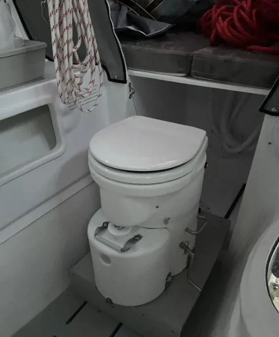 Slide: The Image of 2022 Corsair 880 Sport boat interior with compact marine toilet. - 15