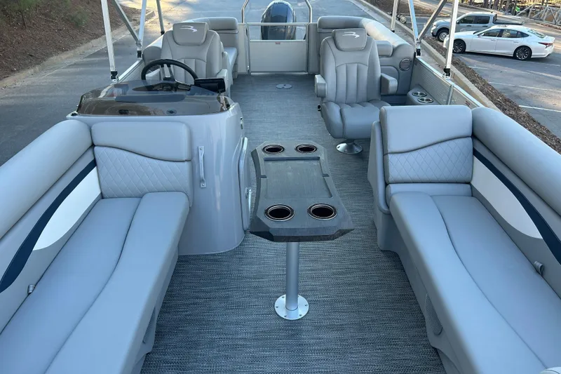 Slide: The Image of 2023 Bennington 23 SSR S pontoon boat interior with gray seating and table. - 18