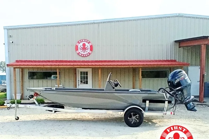 The Image of Thor 1900 Lake Hammer Elite 2026 boat on trailer outside First Mates building. - 0