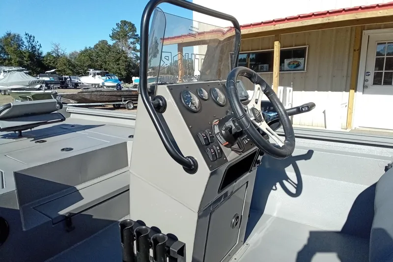 Slide: The Image of Steering console of 2026 Thor 1900 Lake Hammer boat, featuring modern controls and gauges. - 12