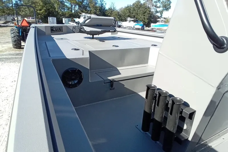 Slide: The Image of 2026 Thor 1900 Lake Hammer boat interior with rod holders and storage compartments. - 13