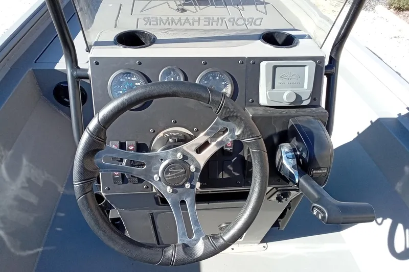 Slide: The Image of Steering console of 2026 Thor 1900 Lake Hammer boat with gauges and controls. - 19