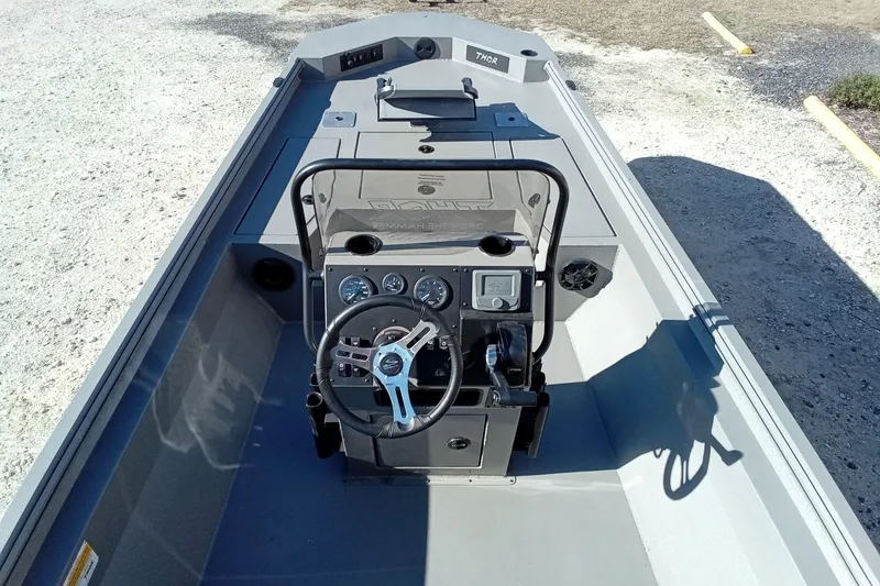 Slide: The Image of 2026 Thor 1900 Lake Hammer boat interior with steering wheel and control panel. - 22